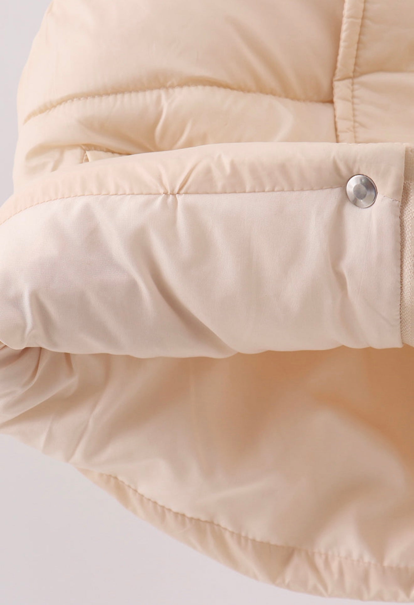 Girl’s cream puffer vest