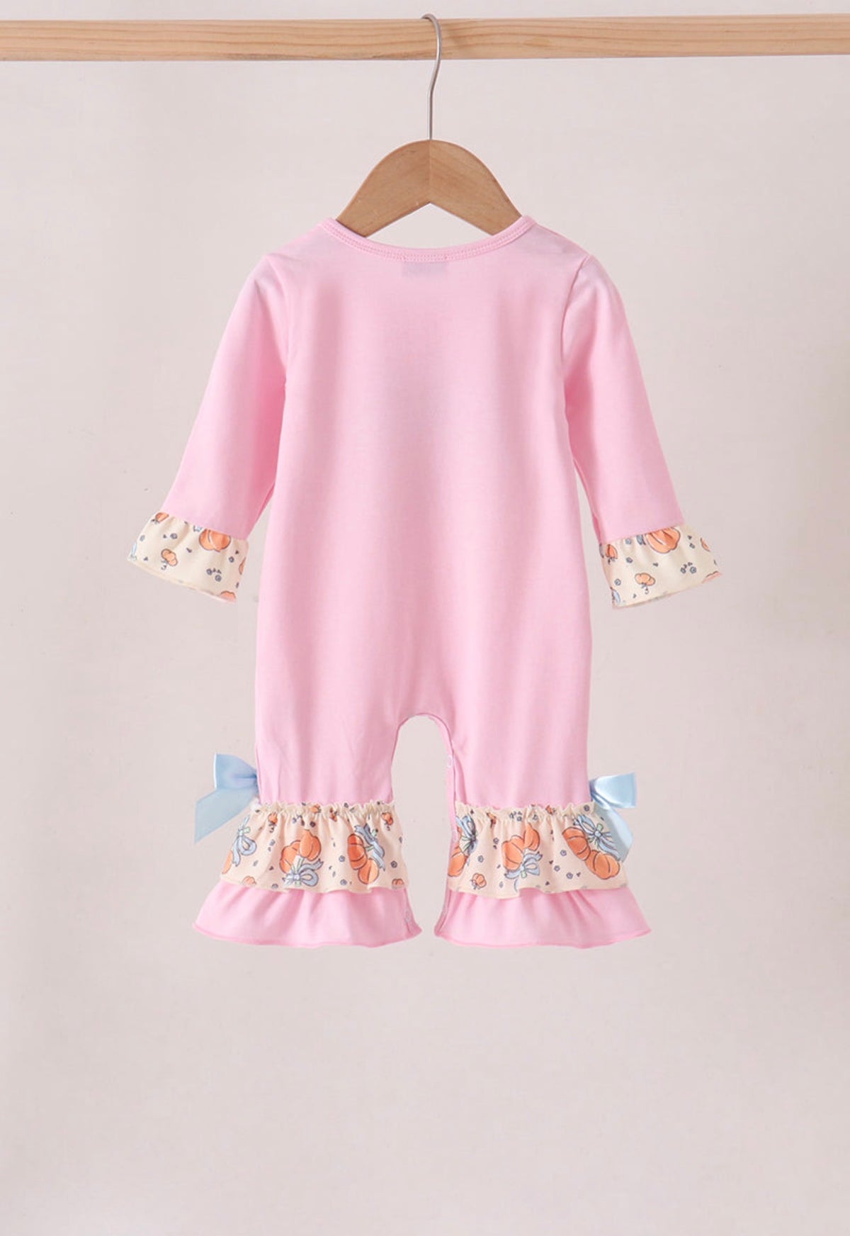 Pink bow pumpkin ruffle romper