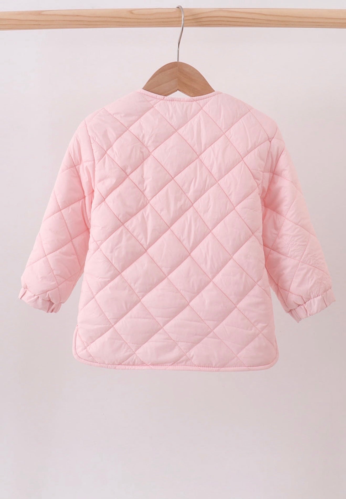 Girl’s pink quilted jacket