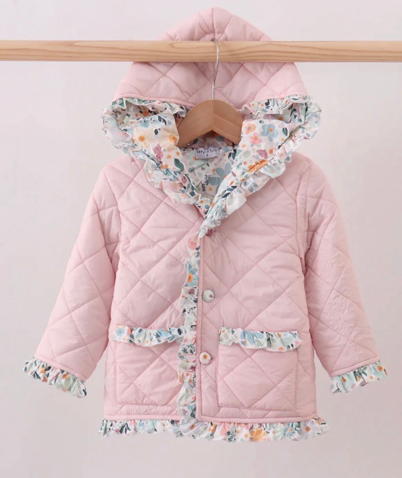 Girl’s pink floral ruffle quilted jacket