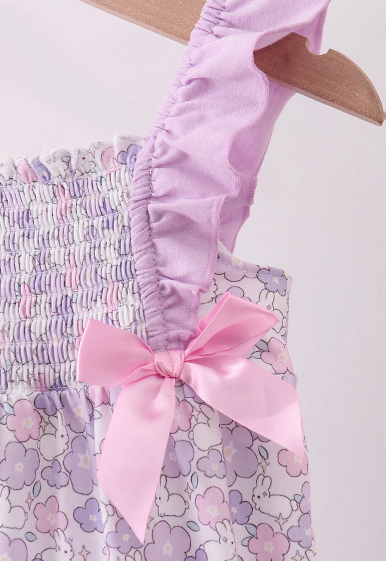 Purple floral smocked girl’s ruffle bubble