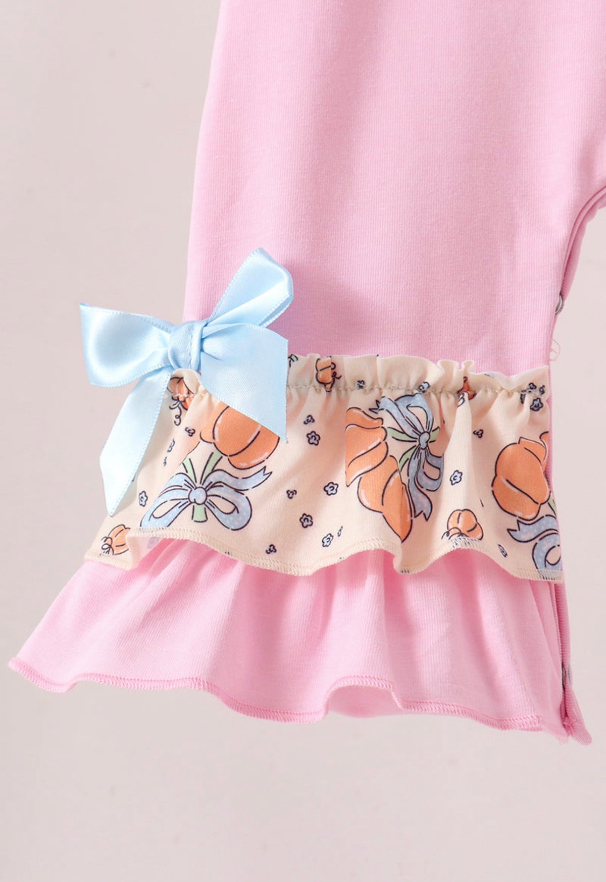 Pink bow pumpkin ruffle romper