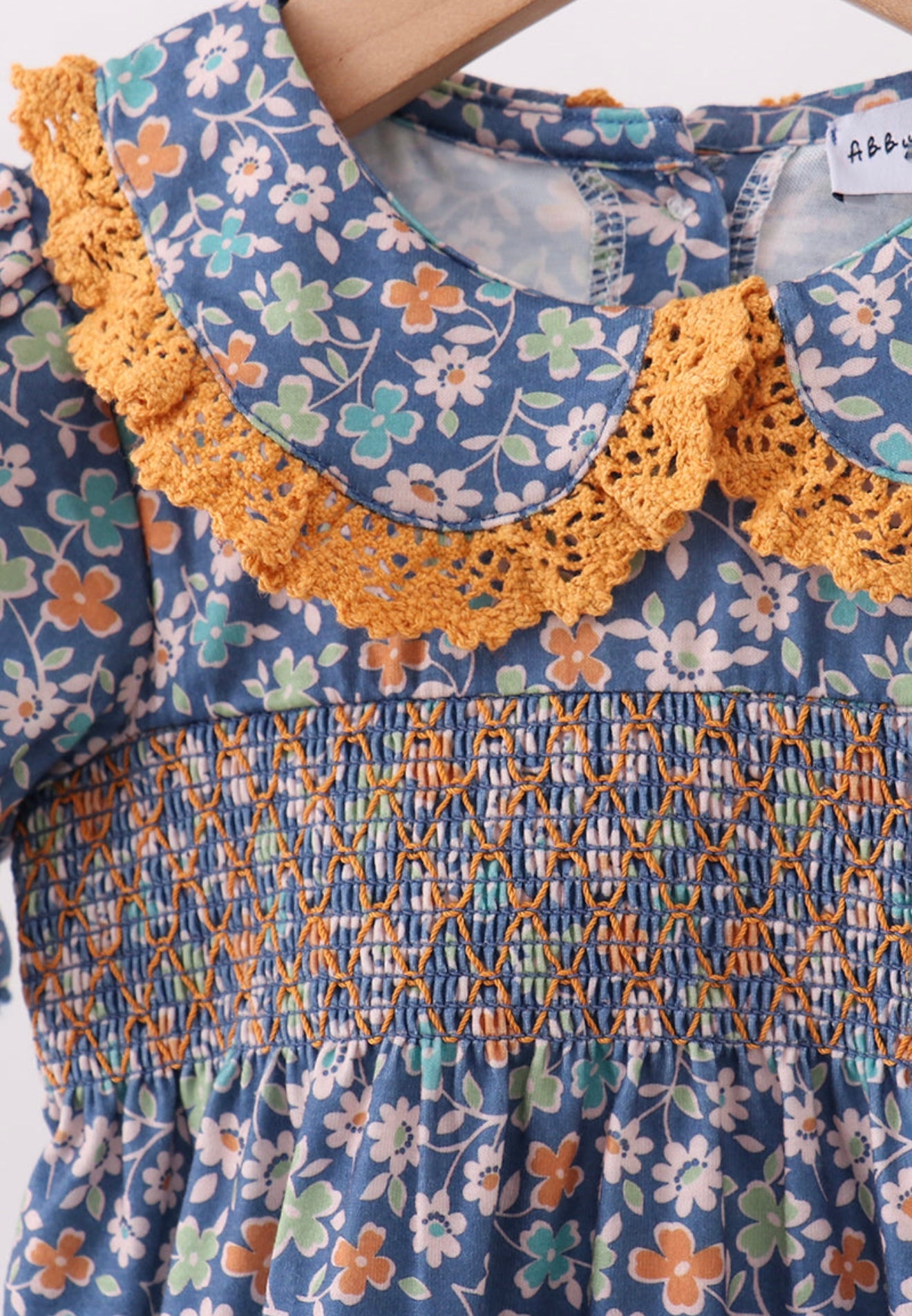 Navy floral smocked ruffle bubble