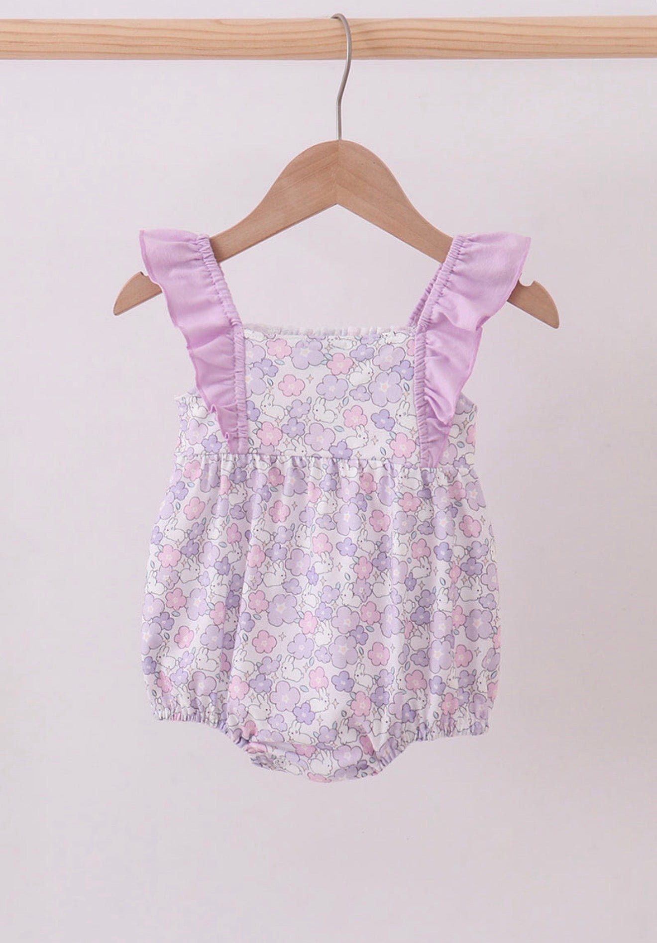 Purple floral smocked girl’s ruffle bubble