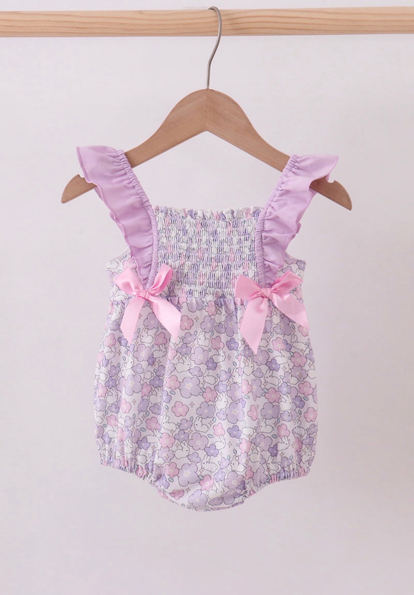 Purple floral smocked girl’s ruffle bubble
